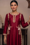 Model posing in a long maroon kurti featuring a gold border and side embroidery.